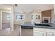 Kitchen with granite countertops overlooking breakfast nook and fireplace in living room at 2950 Winchester Ave, Pahrump, NV 89048