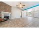 Open living room with stone fireplace and vaulted ceiling features lots of natural light at 2950 Winchester Ave, Pahrump, NV 89048