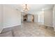 Open living room with tile flooring, a fireplace, and neutral paint at 2950 Winchester Ave, Pahrump, NV 89048