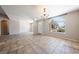 Bright living room featuring tile floors, large window, and neutral color scheme at 2950 Winchester Ave, Pahrump, NV 89048
