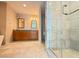 Bright bathroom featuring marble floors, double vanity with wooden cabinets, and glass enclosed shower at 4525 Dean Martin Dr # 2704, Las Vegas, NV 89103