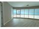Bedroom with light-colored floors and floor-to-ceiling windows offering city views at 4525 Dean Martin Dr # 2704, Las Vegas, NV 89103