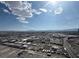 Extensive aerial view of the city with roads, commercial buildings, and mountains in the distance at 4525 Dean Martin Dr # 2704, Las Vegas, NV 89103