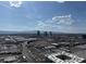 Wide angle city view showcasing buildings, roads, and mountains under a clear sky at 4525 Dean Martin Dr # 2704, Las Vegas, NV 89103