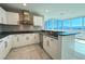 Stylish kitchen featuring white cabinets, granite countertops, and panoramic city views at 4525 Dean Martin Dr # 2704, Las Vegas, NV 89103