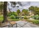Beautiful backyard with a patio overlooking the peaceful lake and greenery at 4963 Crooked Stick Way, Las Vegas, NV 89113