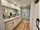 Modern bathroom featuring a glass enclosed shower and granite vanity at 4963 Crooked Stick Way, Las Vegas, NV 89113