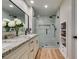 Bright bathroom featuring granite counters, double vanity, and a glass enclosed shower at 4963 Crooked Stick Way, Las Vegas, NV 89113