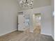 Brightly lit bedroom features plush carpet and adjoins two separate bathrooms and stairwell at 4963 Crooked Stick Way, Las Vegas, NV 89113