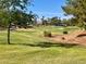 Expansive view of a lush green golf course with trees and well-maintained landscaping at 4963 Crooked Stick Way, Las Vegas, NV 89113