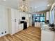 Well-lit kitchen featuring granite countertops, wooden floors and a large island at 4963 Crooked Stick Way, Las Vegas, NV 89113
