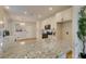 Spacious kitchen featuring a large island, granite countertops, stainless steel appliances, and plenty of cabinet space at 4963 Crooked Stick Way, Las Vegas, NV 89113