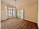 Living room featuring shuttered windows and a elegant chandelier at 4963 Crooked Stick Way, Las Vegas, NV 89113