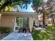 Outdoor patio featuring seating area, grass, and lush landscaping at 4963 Crooked Stick Way, Las Vegas, NV 89113
