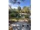 Beautiful pond view with grassy shoreline and ducks in a well-maintained community at 4963 Crooked Stick Way, Las Vegas, NV 89113