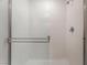 All-white bathroom featuring a tiled shower with glass door, and modern shower fixtures at 518 Descubir Ave, North Las Vegas, NV 89081