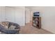 Bedroom with comfortable chair, closet, and a bookshelf. Perfect for relaxing or studying at 518 Descubir Ave, North Las Vegas, NV 89081