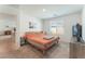 Cozy bedroom featuring a queen bed, window with blinds, and carpet flooring at 518 Descubir Ave, North Las Vegas, NV 89081