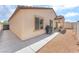 Exterior of a home with a covered patio and landscaped backyard at 518 Descubir Ave, North Las Vegas, NV 89081