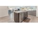 Stylish kitchen with stainless steel appliances, granite countertops, and an island with a dishwasher at 518 Descubir Ave, North Las Vegas, NV 89081