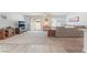 Spacious living room featuring carpet, a sliding door to the patio, and a comfortable seating area at 518 Descubir Ave, North Las Vegas, NV 89081