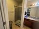 Bathroom with a glass-enclosed shower, tile flooring, and a vanity with granite countertop and sink at 5499 Indian River Dr # 356, Las Vegas, NV 89103
