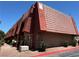 Attractive multi-unit building with desert landscaping, brick and stucco exterior, and a tile roof at 5499 Indian River Dr # 356, Las Vegas, NV 89103