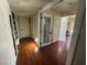 Inviting hallway with wood floors, white doors and trim creating a bright and airy feel at 5499 Indian River Dr # 356, Las Vegas, NV 89103