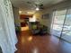 Living area and kitchen view with breakfast bar, laminate floors, and lots of light at 5499 Indian River Dr # 356, Las Vegas, NV 89103