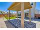 Inviting backyard with a covered patio area, paved flooring, and green landscaping, perfect for relaxing and entertaining guests at 5804 Gossamer Stone Ct, Las Vegas, NV 89141