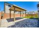 Paver patio, well-maintained lawn, and covered pergola in the backyard provide a perfect space for outdoor gatherings and relaxation at 5804 Gossamer Stone Ct, Las Vegas, NV 89141