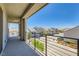 Spacious balcony overlooking the neighborhood street, featuring a sleek railing design and offering ample outdoor space at 5804 Gossamer Stone Ct, Las Vegas, NV 89141