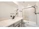 Bathroom featuring modern vanity with light countertops, glass shower, and black plumbing fixtures at 5804 Gossamer Stone Ct, Las Vegas, NV 89141