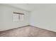 Bedroom with neutral carpet, window with blinds and natural light at 5804 Gossamer Stone Ct, Las Vegas, NV 89141