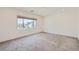 Bedroom with neutral carpet, window with blinds, and view of the neighborhood at 5804 Gossamer Stone Ct, Las Vegas, NV 89141