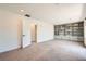 Bedroom featuring neutral carpet and walls, built-in bookcase, and a doorway at 5804 Gossamer Stone Ct, Las Vegas, NV 89141