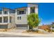 Modern two-story home with a gray color scheme, a two-car garage, and minimal landscaping at 5804 Gossamer Stone Ct, Las Vegas, NV 89141