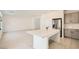 Bright, open-concept kitchen with island, stainless steel appliances, and modern gray cabinets at 5804 Gossamer Stone Ct, Las Vegas, NV 89141