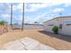 Low maintenance backyard with desert landscaping, tall block fences, and a gravel ground cover at 600 Berry Cir, Las Vegas, NV 89107