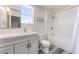 A bright bathroom featuring a shower and vanity with mirror at 600 Berry Cir, Las Vegas, NV 89107