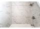 Bathroom showcasing a shower with marble-look tiles and a modern shower head and hardware at 600 Berry Cir, Las Vegas, NV 89107