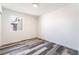 Clean bedroom features neutral walls, a window bringing natural light, and contemporary-style flooring at 600 Berry Cir, Las Vegas, NV 89107