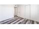 Clean bedroom featuring modern flooring, closet and multiple points of access including an ensuite at 600 Berry Cir, Las Vegas, NV 89107