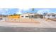 Charming single-story home featuring a well-kept front yard with a fence and a covered front porch at 600 Berry Cir, Las Vegas, NV 89107