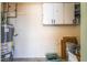 Utility room with a water heater, storage cabinets, and space for laundry appliances or additional storage at 600 Berry Cir, Las Vegas, NV 89107