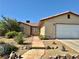 Charming single-story home featuring a rockscaped front yard with drought tolerant landscaping and a two-car garage at 6357 Cobalt Ln, Las Vegas, NV 89146