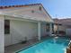 View of backyard with covered patio and pool equipment at 6636 Old Oxford Ave, Las Vegas, NV 89108