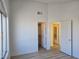 Bedroom with two closets, doors and wood-look flooring at 6636 Old Oxford Ave, Las Vegas, NV 89108