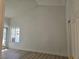Bright bedroom features new floors, a sliding glass door, and vaulted ceilings at 6636 Old Oxford Ave, Las Vegas, NV 89108