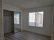 Bright bedroom featuring a large window and mirrored closet doors at 6636 Old Oxford Ave, Las Vegas, NV 89108